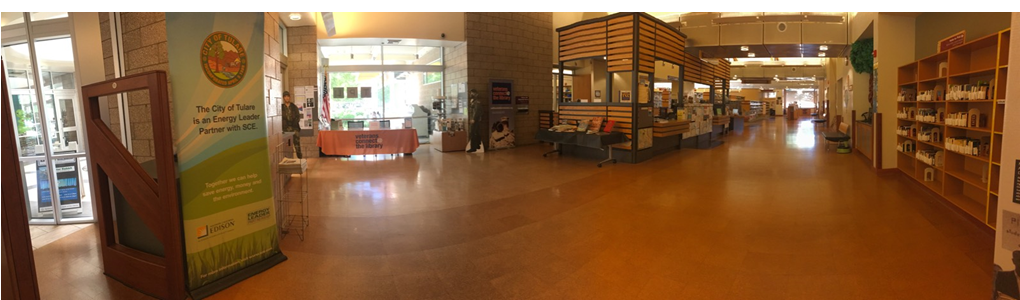 A panoramic view of the Tulare Public Library entrance, Veteran Resource Center, and Circulation Desk.